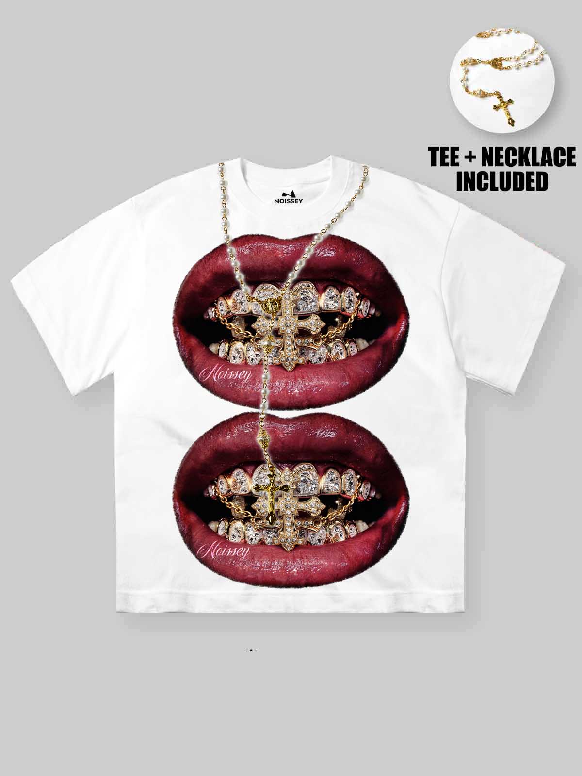 White short-sleeve graphic T-shirt featuring a large print of two glossy red lips with gold-and-ruby grills, shown on a light gray background. A small inset at the top right shows an included necklace, with text reading 'TEE + NECKLACE INCLUDED'.