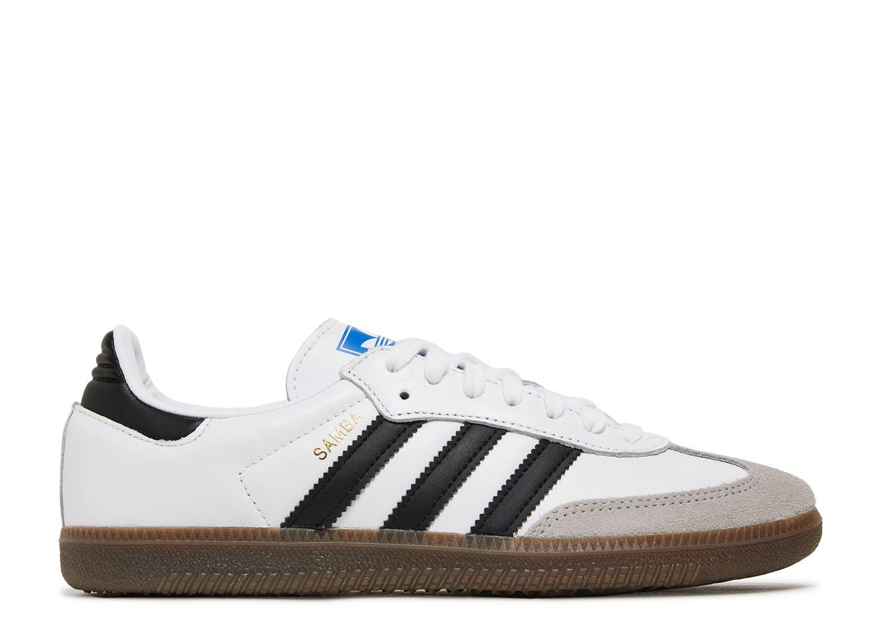 The Adidas Samba OG Cloud White Core Black (model B75806) is a white sneaker with black stripes, a gum sole, gray suede toe, and gold Samba lettering on the side, shown from the left.