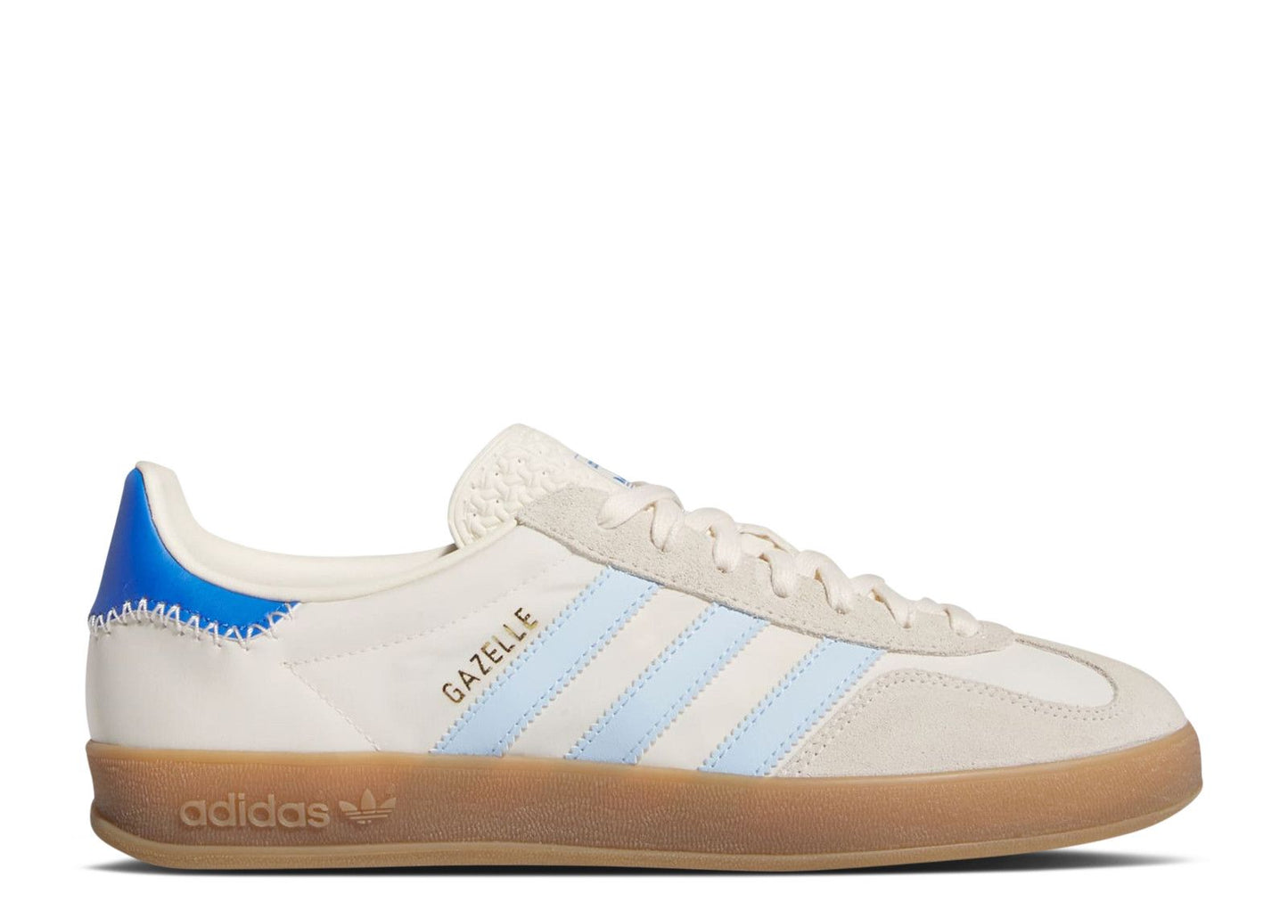 The Adidas Gazelle Indoor Off White Clear Sky features a white upper, light blue stripes, a beige suede toe, a tan gum sole, and a blue heel tab with "GAZELLE" in gold on the side. Model: JI2004.