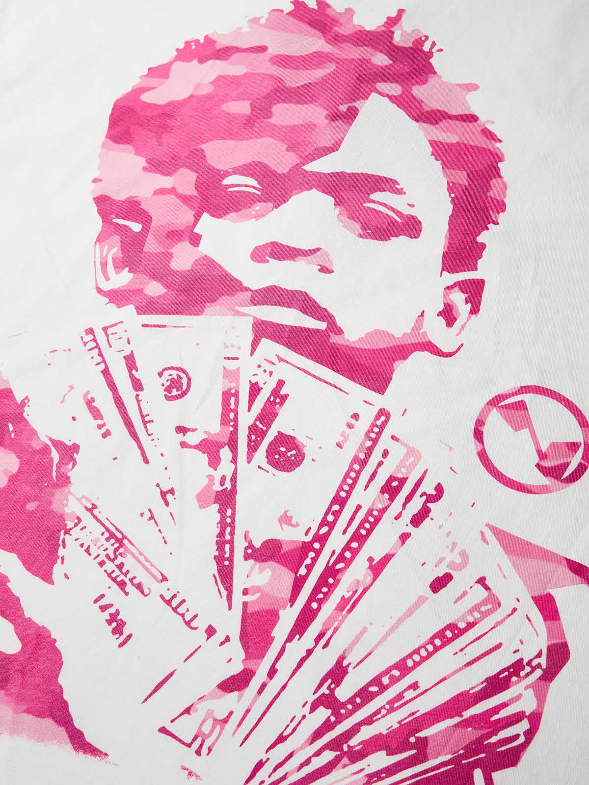 Close-up of young boy portrait with pink camouflage face holding 100 dollar bills