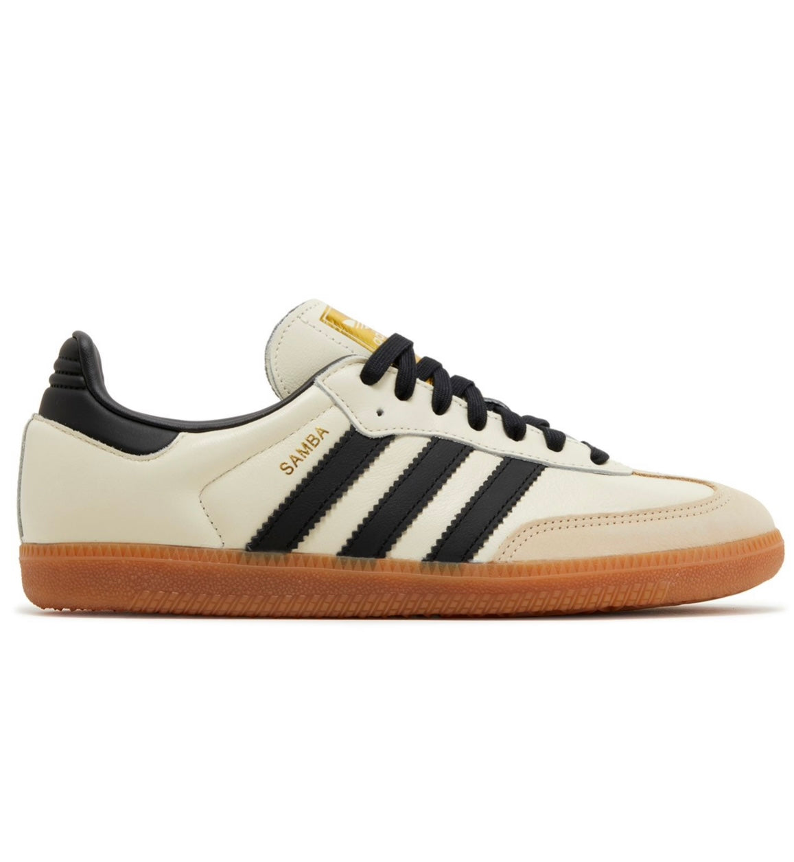 The Adidas Samba OG Cream White Sand Strata W features a cream upper, black stripes and heel tab, gold SAMBA branding, a white tongue, black laces, and a brown gum sole in the classic side profile view.