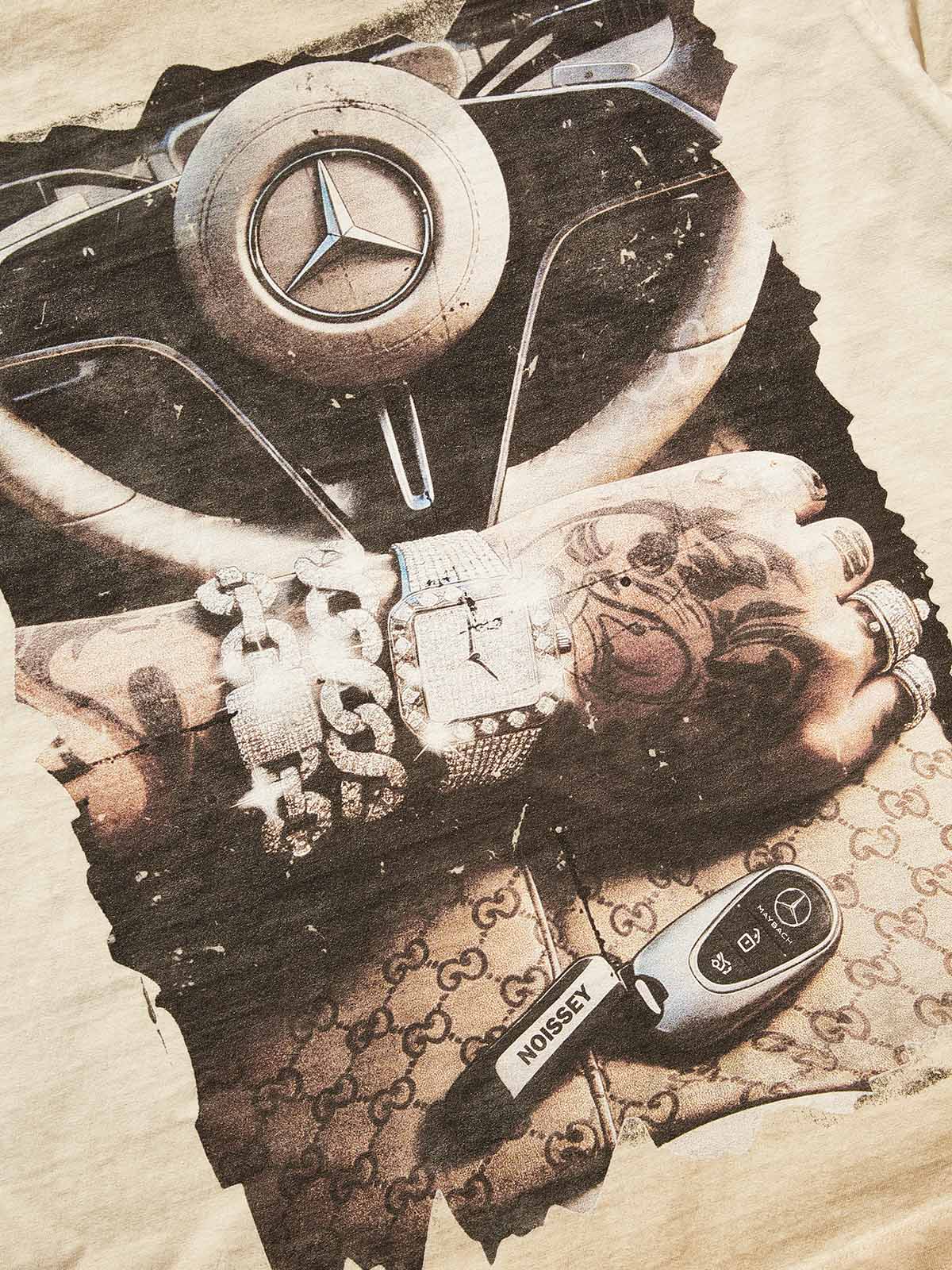 Macro shot of the high-definition print showing the detail on the luxury watch and car logo.