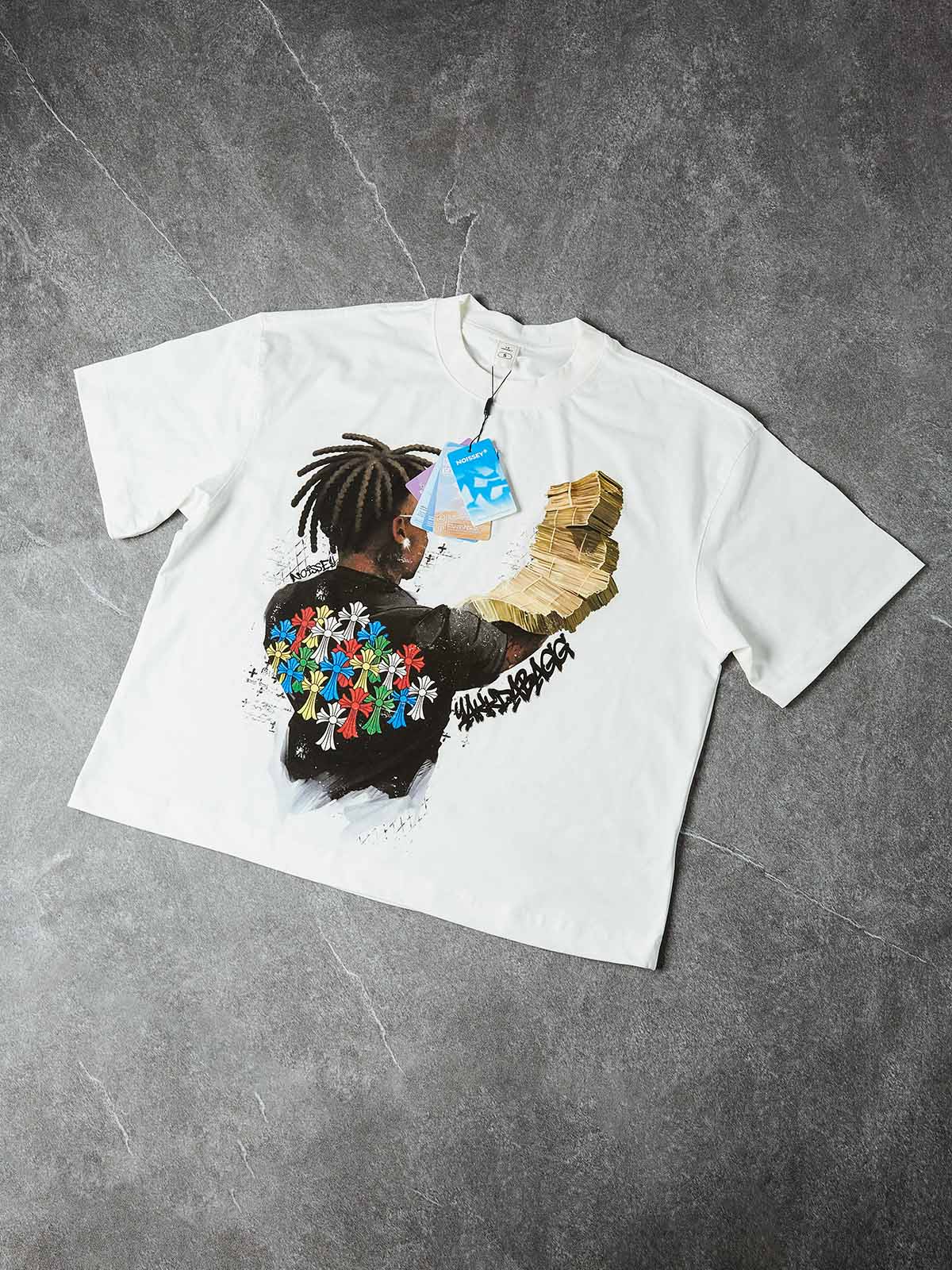 Studio layout of the 280GSM cotton tee highlighting the "Money Stack" art and the vibrant primary colors of the cross-cluster graphic.
