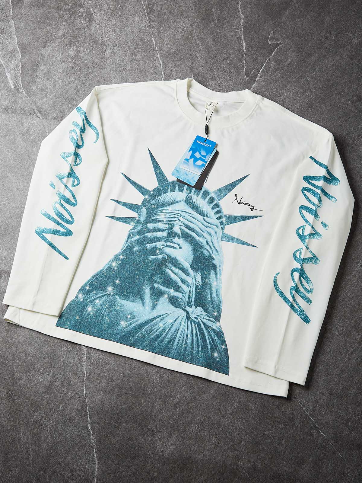 NOISSEY "Liberty Blinded" Teal Diamond Sparkle Graphic Long Sleeve Sweatshirt