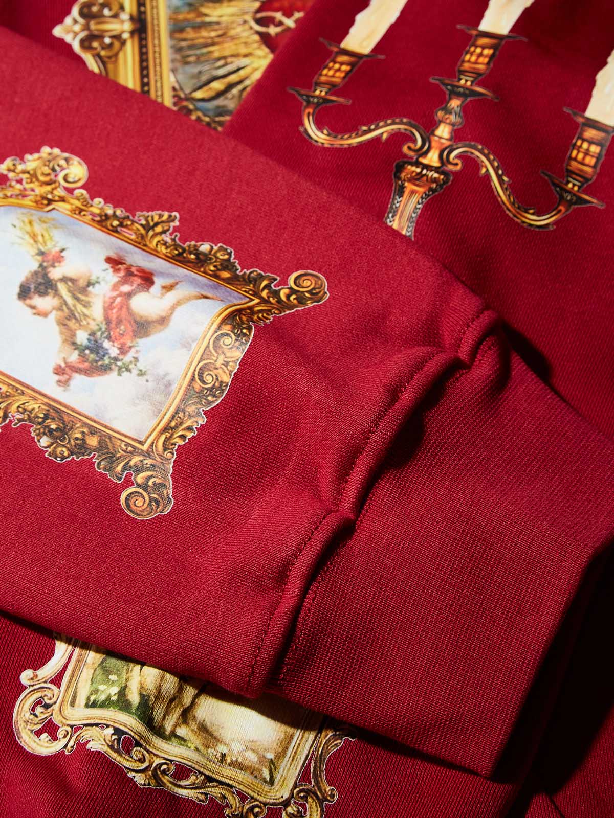 Red Hoodie Adorned with Religious Icons