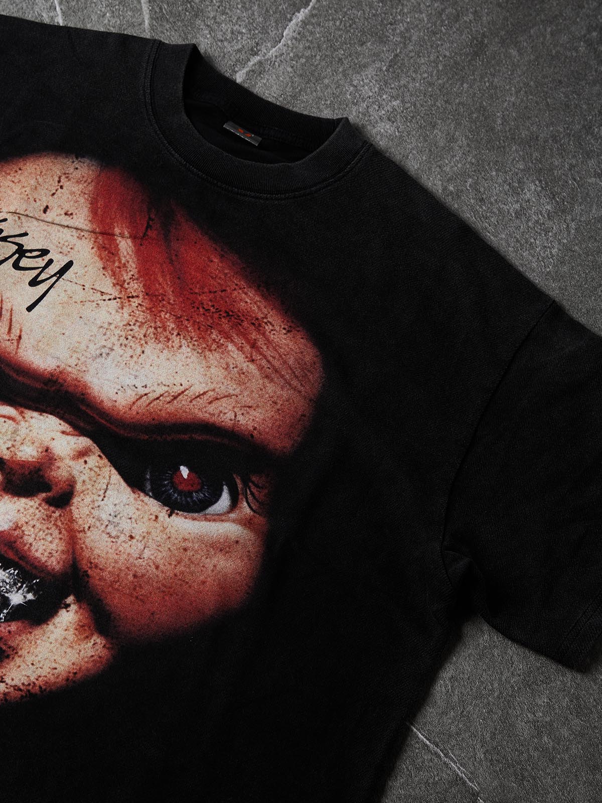 NOISSEY Chucky Vintage Distressed Boxy Hem Graphic Art Tee - Faded Black