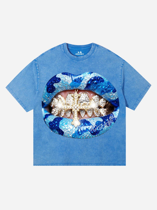 Front view of the Noissey Blue Grillz T-Shirt featuring a large graphic of diamond grillz and blue camo lips on an acid-wash blue tee.
