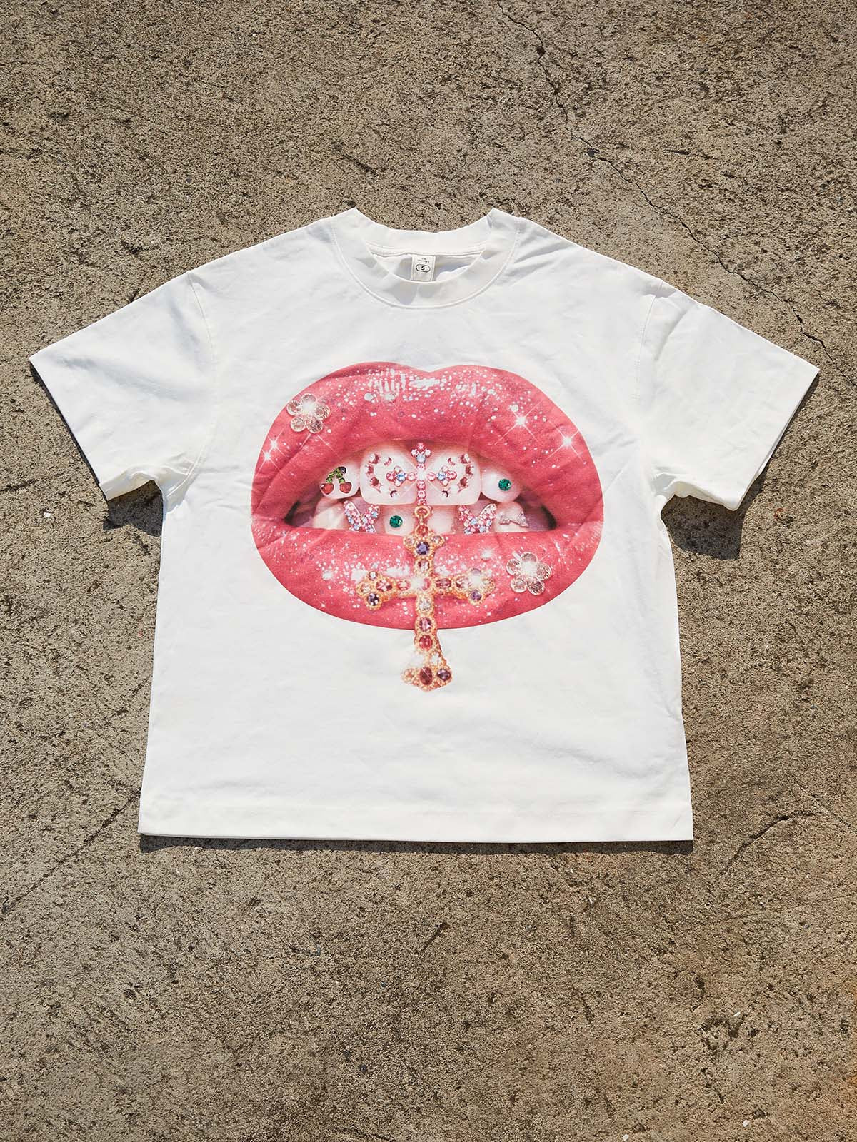 NOISSEY oversized "Holy Shine" T-shirt showcasing the iconic Y2K luxury hustle artwork.