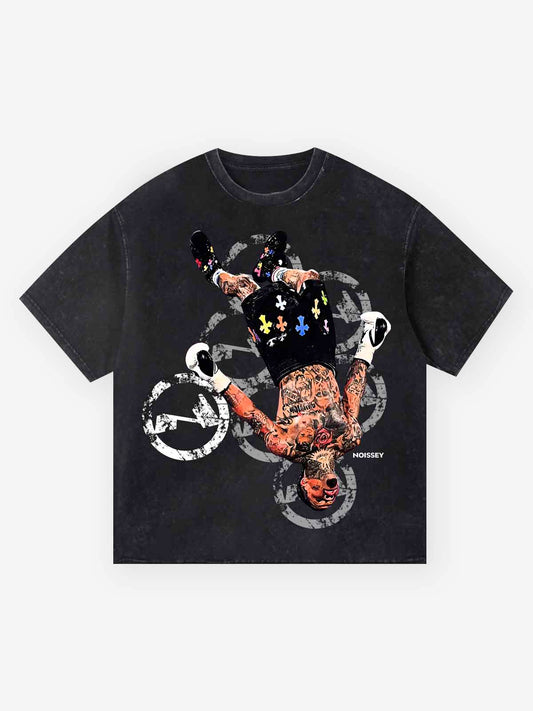 NOISSEY vintage wash black tee featuring upside down tattooed fighter graphic